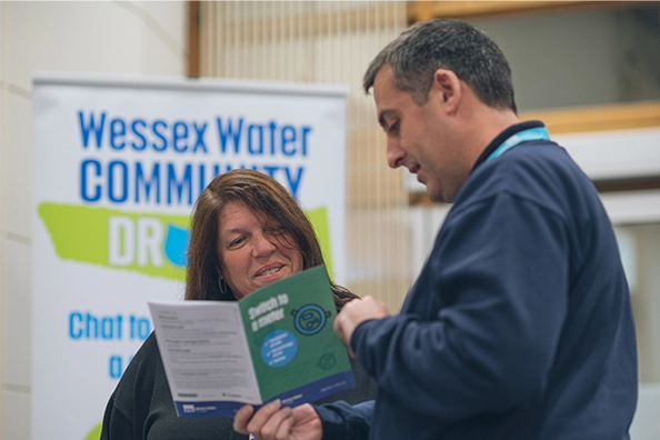 Drop In Adviser Talking With A Customer