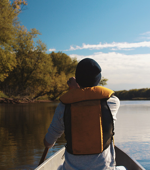 Man Canoeing on a sunny day